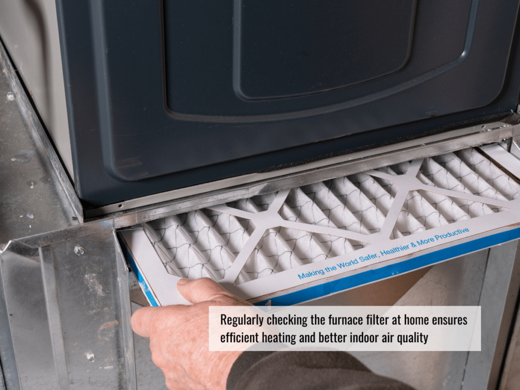 A man's hands are shown changing the filter on a furnace
